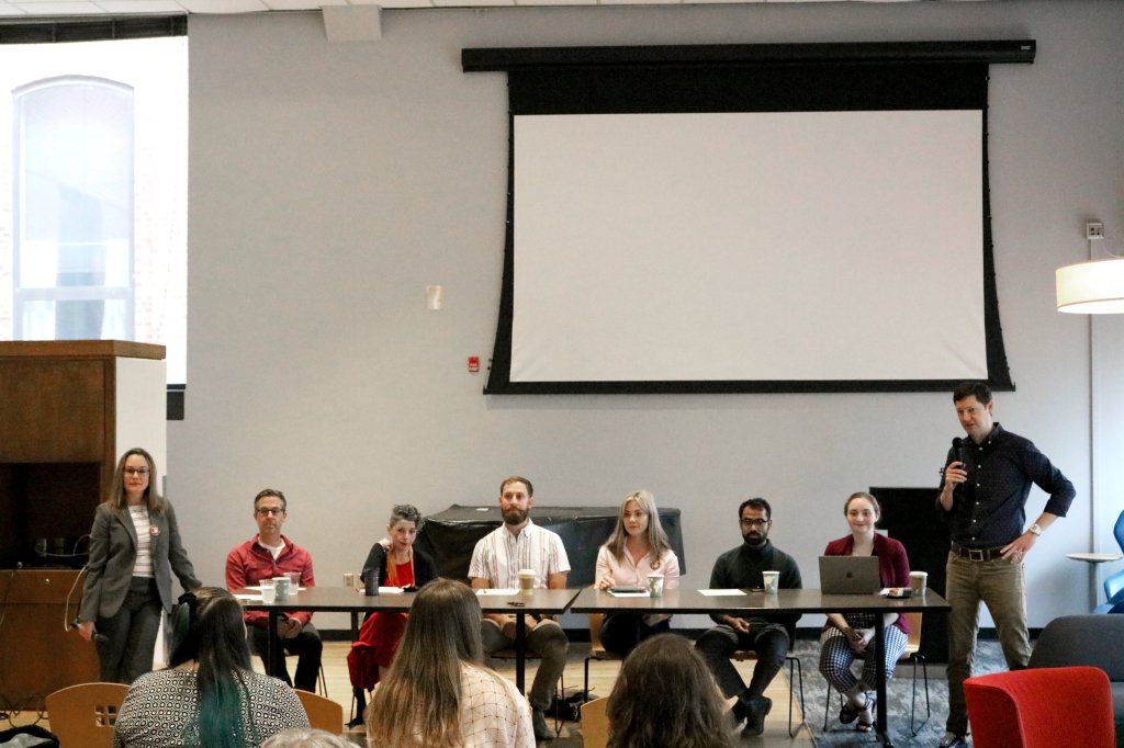 This image has an empty alt attribute; its file name is symposium1.jpg